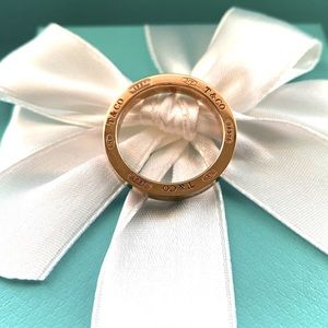 Tiffany & Co. ring 18 k solid Gold it has that Tiffany Rosish color gold to it.